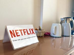 a sign that says netflix sitting on top of a table at Casale 1541 in Bolsena