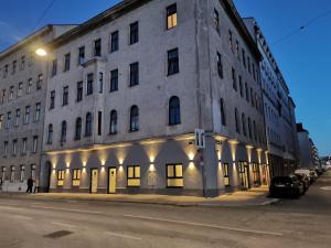 a large building on the corner of a street at La Vienna Suites - Apartments Hauptbahnhof in Vienna