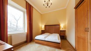 Postel nebo postele na pokoji v ubytování Hotel Marienhof