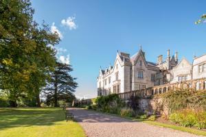 a large building with a pathway in front of it at Lilleshall House and Gardens in Telford