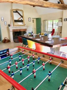 a room with a table and toy figures on it at Villandry - Domaine de l'Augeonnière in Villandry