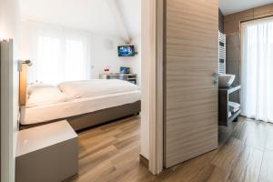 Rúm í herbergi á Albergo Garni Francesco