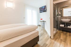 Rúm í herbergi á Albergo Garni Francesco
