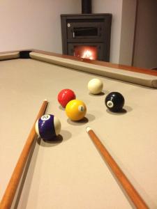 a group of billiard balls on a pool table at Rio d'Azenha - Country House in Roliça