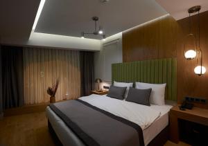 a bedroom with a large bed and a large window at Dundar Hotel & Spa in Istanbul