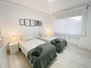 Posteľ alebo postele v izbe v ubytovaní GMC Turistics - La Casita de Atarazanas