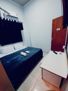 Cama o camas de una habitación en Ágape Hotel