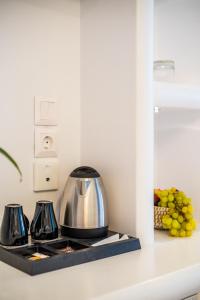 a kitchen counter with a tea kettle and a toaster at Hotel Summer Dream in Kamari