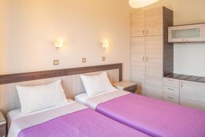 Ein Bett oder Betten in einem Zimmer der Unterkunft Stella Bay Rooms
