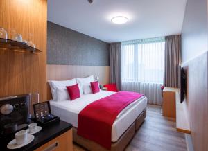 Postel nebo postele na pokoji v ubytování Ocak Hotel