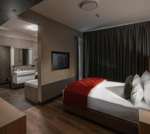 Postel nebo postele na pokoji v ubytování Ocak Hotel