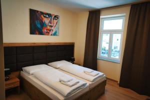 Posteľ alebo postele v izbe v ubytovaní M-24 Apartments