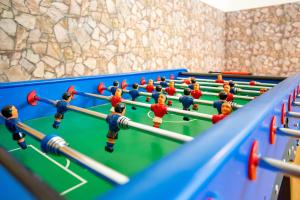 a group of toy people playing a game of billiard at Gasthaus und Hotel Göttler Josef in Rumeltshausen