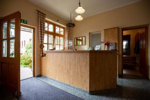 a kitchen with a wooden counter in a room at Gasthaus und Hotel Göttler Josef in Rumeltshausen