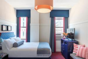 Postel nebo postele na pokoji v ubytování Hotel Triton