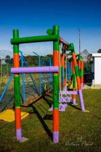 a park with a colorful playground equipment at Apartamento cerca al Parque del Café, Eje Cafetero in Montenegro