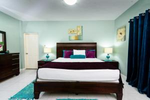 Кровать или кровати в номере Hotel Tim Bamboo