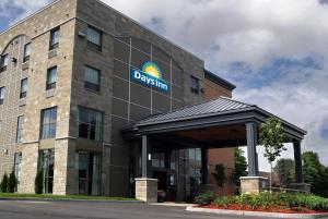 a building with a sign on the front of it at Days Inn by Wyndham Levis in Lévis