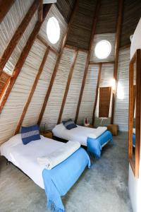 Säng eller sängar i ett rum på Tribu Todos Santos