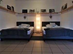 A bed or beds in a room at Borálom Apartman Tokaj