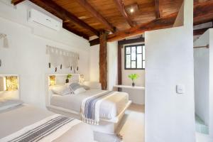 Ένα ή περισσότερα κρεβάτια σε δωμάτιο στο Amansala Resort