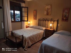 A bed or beds in a room at LOS ABUELOS