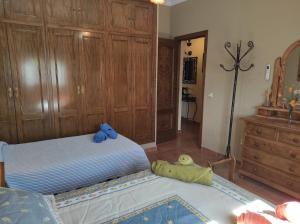 A bed or beds in a room at LOS ABUELOS