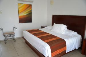 Postel nebo postele na pokoji v ubytování Hotel Boutique Casa Bella