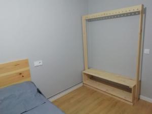 Łóżko lub łóżka w pokoju w obiekcie Ecorooms PADRÓN
