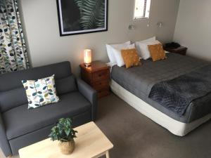 Postel nebo postele na pokoji v ubytování Kauri Motel on Riccarton