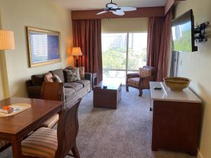 a living room with a couch and a table at Ocean View Luxurious Condo-BEST location + balcony in Destin