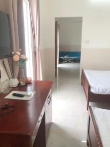 Postel nebo postele na pokoji v ubytování Magnolia Hotel Cam Ranh