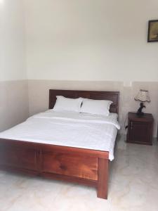 Postel nebo postele na pokoji v ubytování Magnolia Hotel Cam Ranh