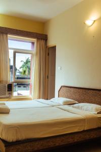 Postel nebo postele na pokoji v ubytování Hotel Arcadia