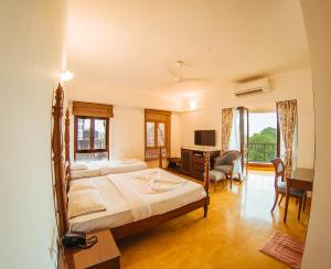 Postel nebo postele na pokoji v ubytování Hotel Arcadia