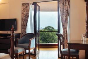 TV a/nebo společenská místnost v ubytování Hotel Arcadia