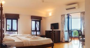 Postel nebo postele na pokoji v ubytování Hotel Arcadia