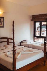 Postel nebo postele na pokoji v ubytování Hotel Arcadia