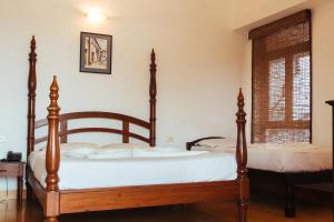 Postel nebo postele na pokoji v ubytování Hotel Arcadia