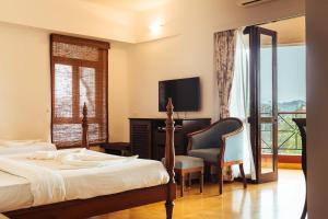 Postel nebo postele na pokoji v ubytování Hotel Arcadia