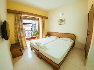 Postel nebo postele na pokoji v ubytování Hotel Arcadia