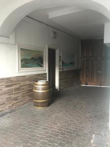 a room with a barrel in the middle of a room at Hotel Martin in Volpiano