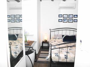 a bedroom with two beds and a table at Apartment Bonbon in Dubrovnik