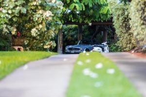 a car parked on a road in a driveway at The Kulani Maui in Lahaina