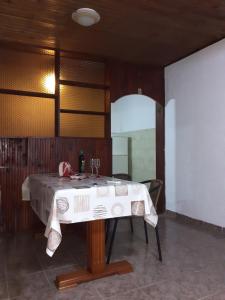 a table in a room with a white table cloth at Studio-apartman Milena 2 in Podgorica