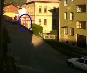 a blue circle in the middle of a street with buildings at Studio apartman Ela in Travnik