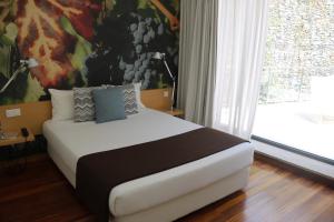 Ein Bett oder Betten in einem Zimmer der Unterkunft LBV House Hotel