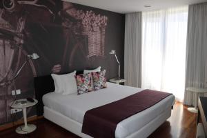 Ein Bett oder Betten in einem Zimmer der Unterkunft LBV House Hotel
