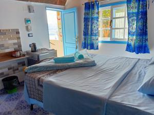 Postel nebo postele na pokoji v ubytování Nuba Tod Abouda Guest House