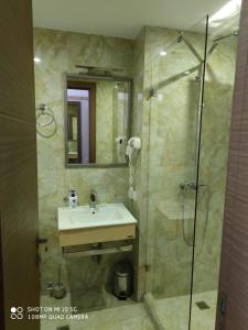 a bathroom with a sink and a shower at NewGudauri Block 2 #308 in Gudauri